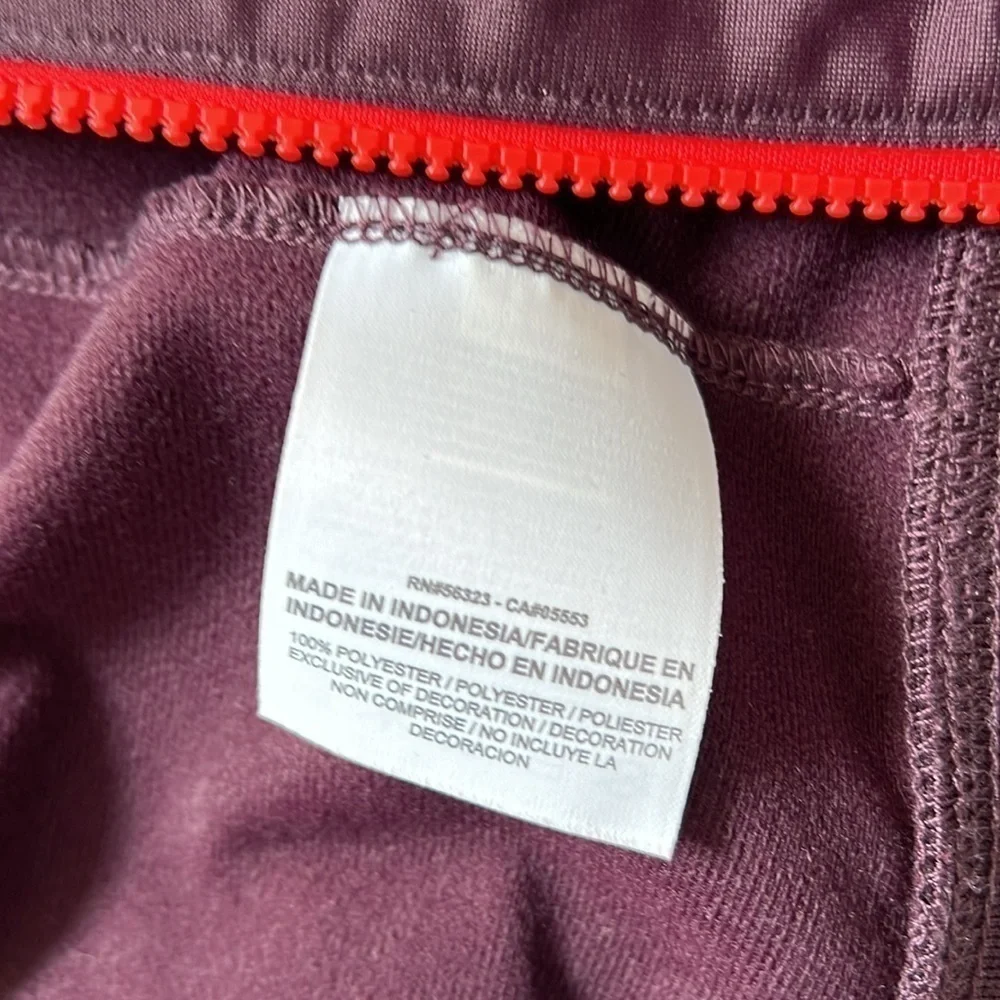 Maroon Nike Jacket size XL Youth black and orange detailing fits womens M/L